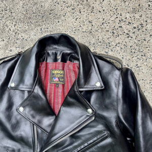 Black biker jacket close shot of collar and tag